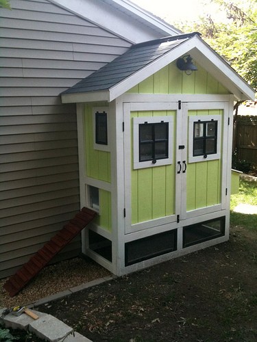 Backyard-Chickens-two-door-chicken-coop-alongside-house.jpg