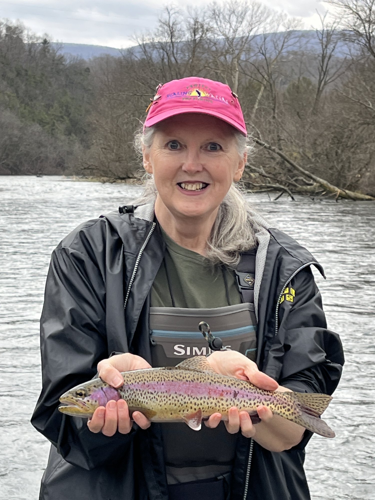 Donna and 15-inch rainbow trout.JPG